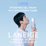 BTS Jin gazes upward, holding a bottle of Laneige Cream Skin Zincpeptide™ Toner & Gel Moisturizer, showcasing the product's lightweight, hydrating gel cream texture in a toner.