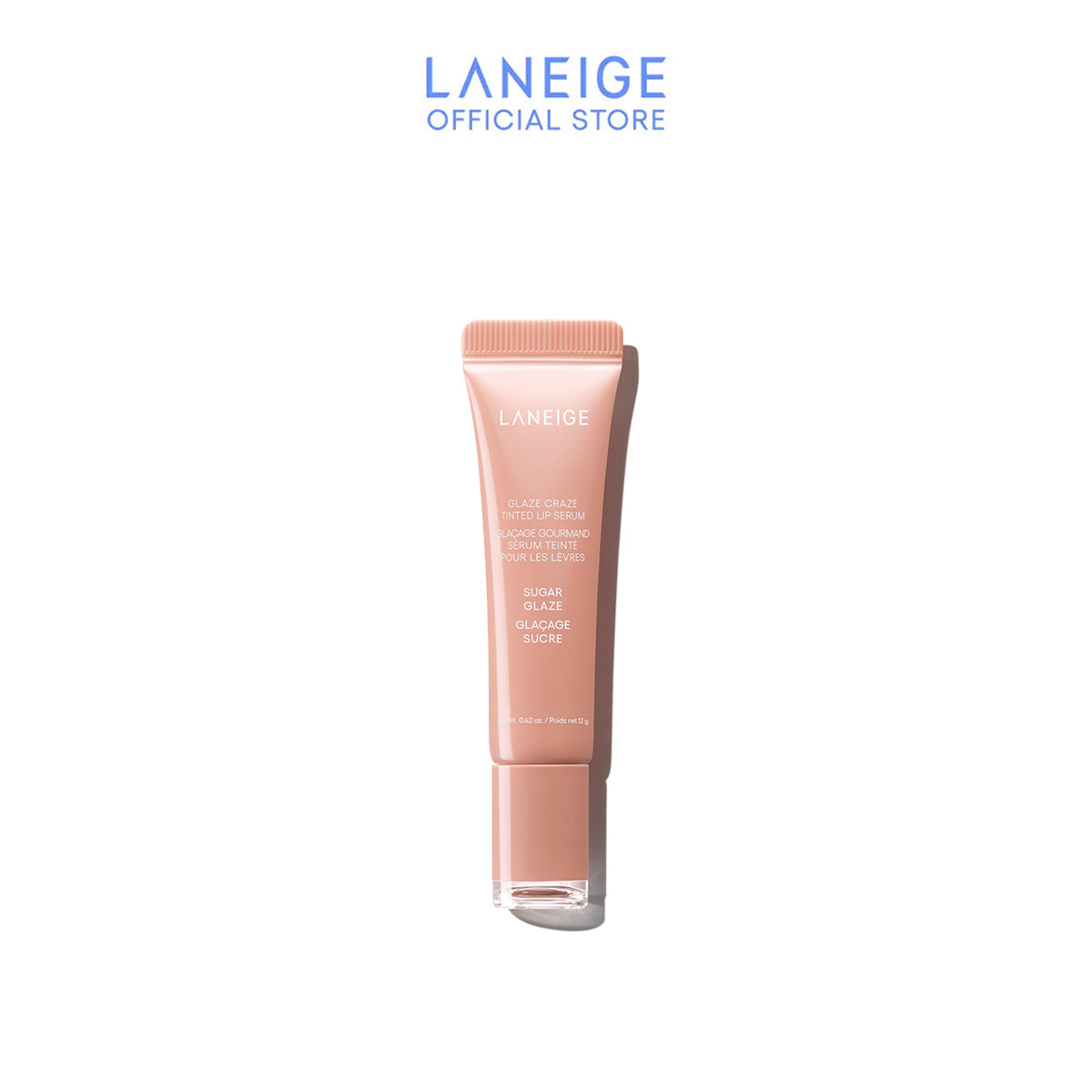 A tube of Laneige Glaze Craze Tinted Lip Serum, shown upright against a white background, showcases its peachy-pink hue and promises a high-shine, radiant glow to the lips.