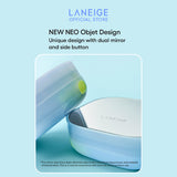 A pale blue Laneige Neo Cushion refill case, featuring a unique dual mirror and side button design, rests at a slight angle, showcasing its sleek and modern aesthetic.
