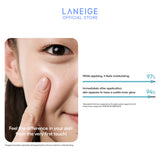 A woman's finger gently applies Laneige Neo Cushion, showcasing its moisturizing effect and the immediate subtle inner glow it imparts to her skin.